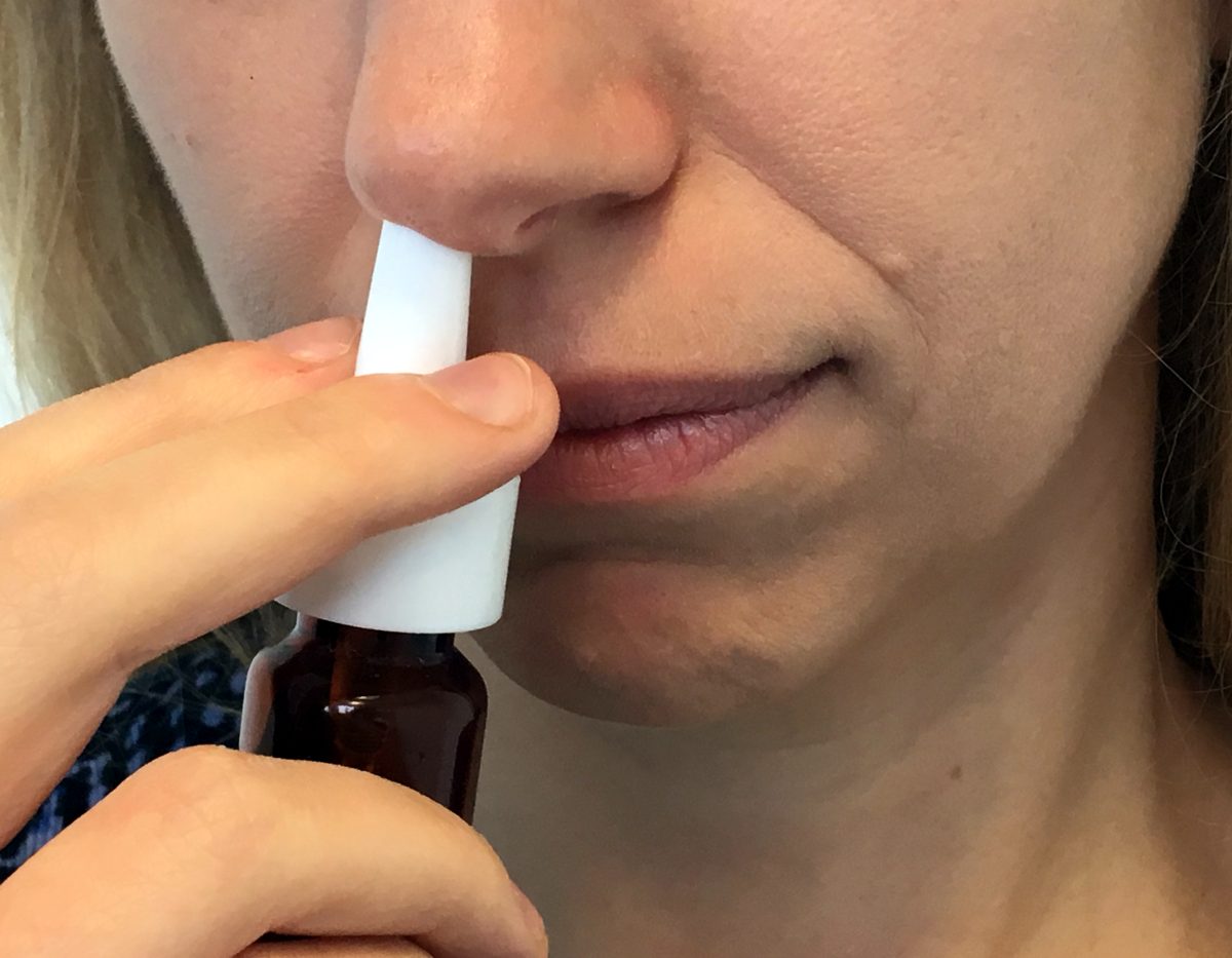 Woman using a nasal spray, per the file description; illustrative image